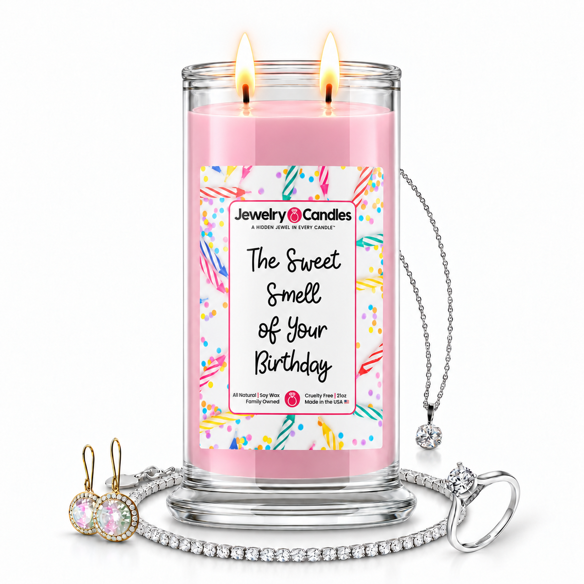 The Sweet Smell of Your Birthday Jewelry Candle with two lit flames and jewelry