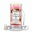 Believe in the Magic of Our Anniversary Jewelry Candle with two lit flames and jewelry