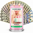 Birthday Sex Cash Candle with two lit wicks and a fan of cash