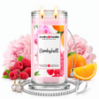 Bombshell Jewelry Candle with two lit flames and jewelry