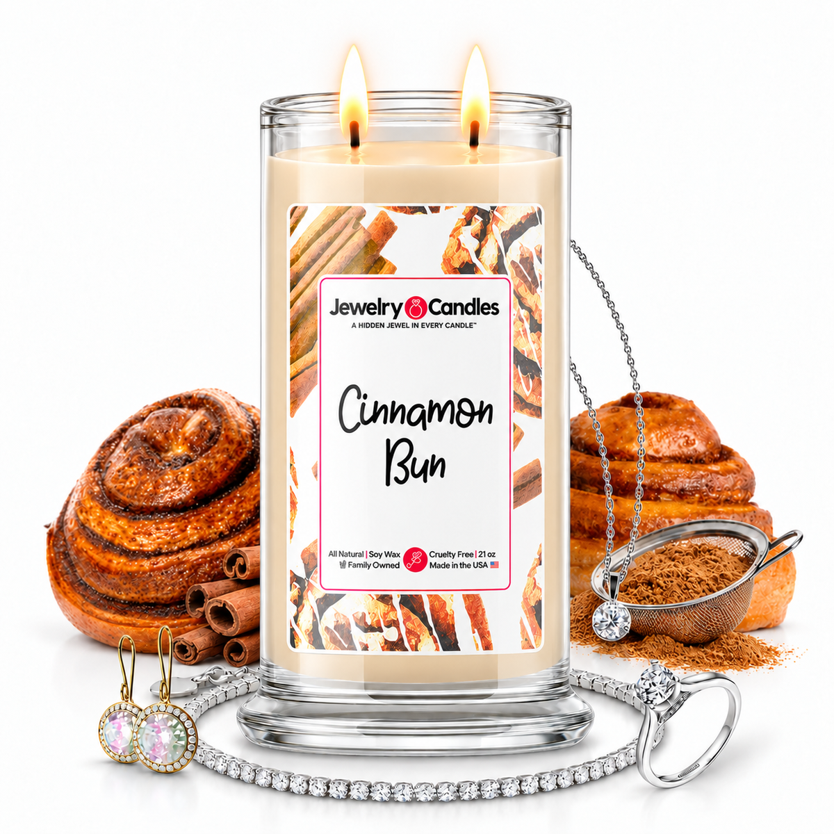 Cinnamon Bun Jewelry Candle with two lit flames and jewelry