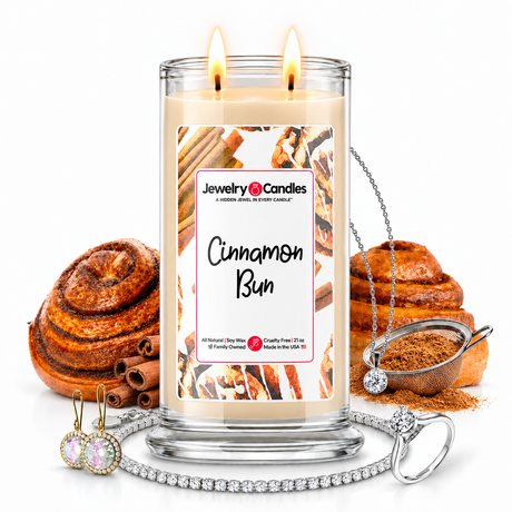 Cinnamon Bun Jewelry Candle with two lit flames and jewelry