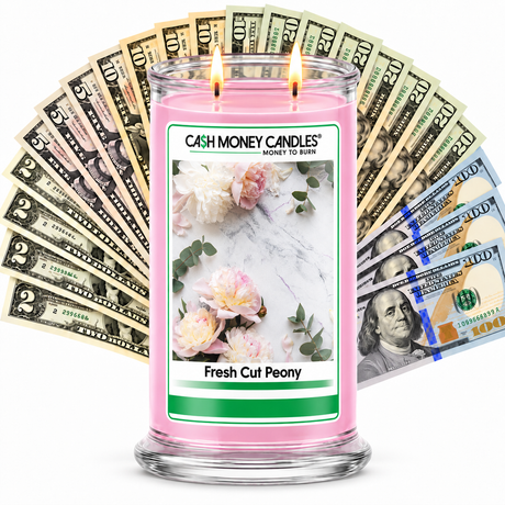 Fresh Cut Peony Cash Money Candle with two lit wicks and a fan of cash