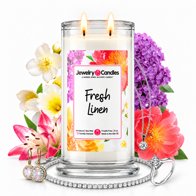 Fresh Linen Jewelry Candle with two lit flames and jewelry