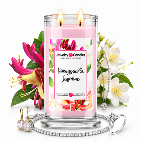 Honeysuckle Jasmine Jewelry Candle with two lit flames and jewelry