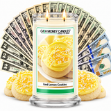 Iced Lemon Cookies Cash Money Candles with two lit wicks and a fan of cash