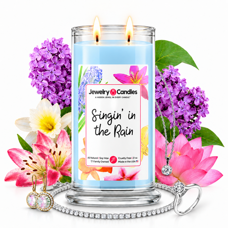 Singin' in the Rain Jewelry Candle with two lit flames and jewelry