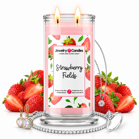 Strawberry Fields Jewelry Candle with two lit flames and jewelry