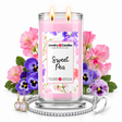Sweet Pea Jewelry Candle with two lit flames and jewelry