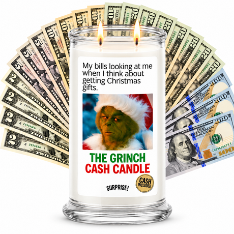 The Grinch Cash Candle with two lit wicks and a fan of cash