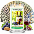 Wine Country Cash Money Candle with two lit wicks and a fan of cash