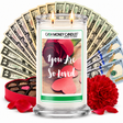 You Are So Loved Cash Money Candle with two lit wicks and a fan of cash