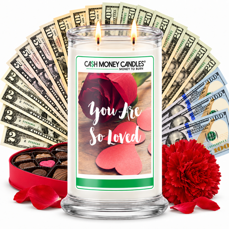 You Are So Loved Cash Money Candle with two lit wicks and a fan of cash