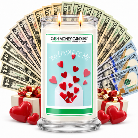 You Complete me Cash Money Candle with two lit wicks and a fan of cash